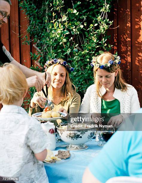 midsummer celebrations at a table. - midsommar imagens e fotografias de stock