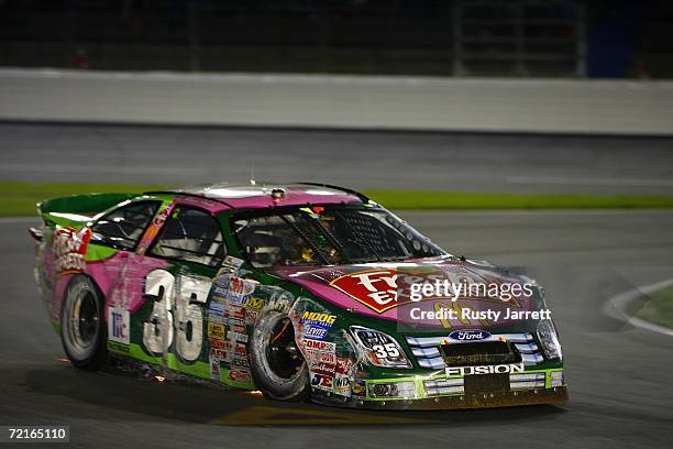 Regan Smith, driver of the Fresh Express Ford, drives on pit road after crashing into the wall, during the NASCAR Busch Series Dollar General 300 on...