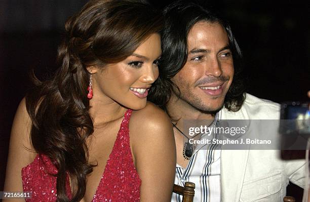 Miss Universe Zuleyka Rivera and Jorge Moreno pose for photos at the Youth Aids Gala on October 13, 2006 in McLean, Virginia. YouthAIDS will host its...