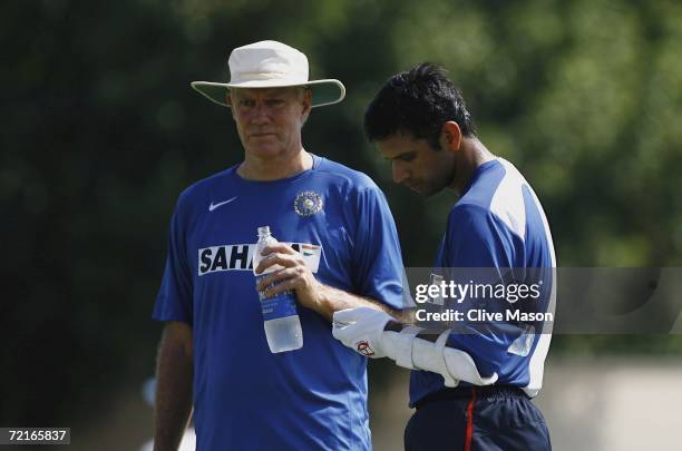 Rahul Dravid of India talks to coach Greg Chappell during a practice session ahead of the match between India and England in the ICC Champions...