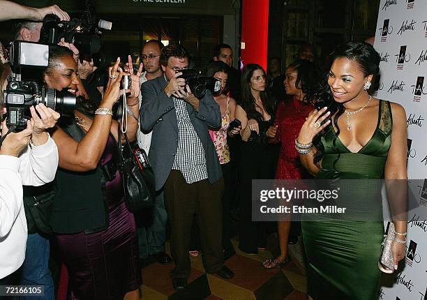 Singer/actress Ashanti poses for photographers and her mother Tina Douglas outside the Tao Nightclub at the Venetian Resort Hotel Casino during...
