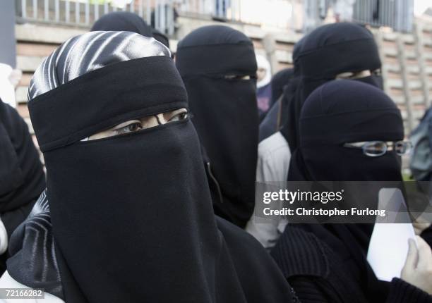 Muslim women wearing niqabs veil protest outside Bangor Street Community centre where Leader of the House of Commons Jack Straw is holding one of his...