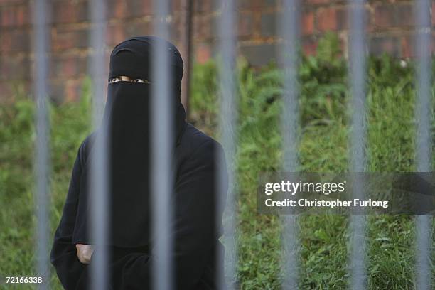 Muslim women wearing niqab and burqa veils protest outside Bangor Street Community centre where Leader of the House of Commons Jack Straw is holding...