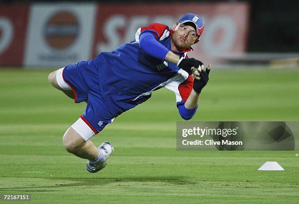 Ian Bell of England dives for a catch during a practice session ahead of the match between India and England in the ICC Champions Trophy, at the RCA...