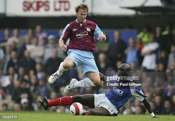 Teddy Sheringham of West Ham United evades a challenge from Sol Campbell of Portsmouth during the Barclays Premiership match between Portsmouth and...