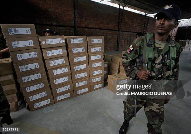 An Ecuadorean soldier guards electoral kits for Sunday's election at the Electoral Tribunal in Guayaquil, 14 October 2006. Leftist US critic Rafael...