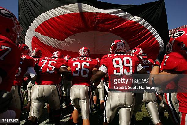 Members of the Georgia Bulldogs take the field against the Vanderbilt Commodores during their game at Sanford Stadium on October 14, 2006 in Athens,...
