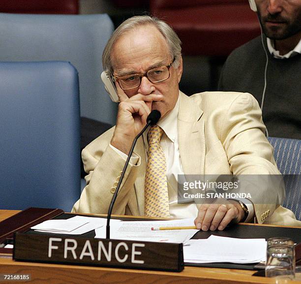 Jean-Marc de La Sabliere, France's Ambassador to the United Nations, listens to speakers in the Security Council, 14 October 2006, after the Council...