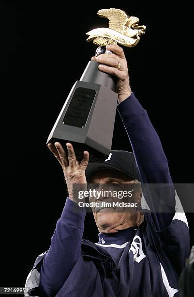 Manager Jim Leyland of the Detroit Tigers holds up the American League Championship trophy after the Tigers 6-3 win against the Oakland Athletics...