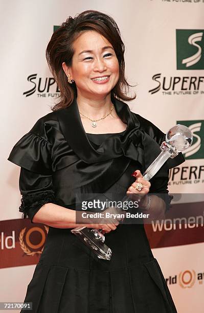 Miky Lee poses with her World Business Award in the media room backstage at the 3rd Annual Women's World Awards at Hammerstein Ballroom October 14,...