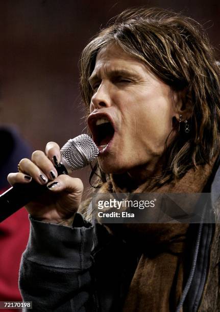 Steven Tyler performs God Bless America during game three of the NLCS between the New York Mets and the St. Louis Cardinals at Busch Stadium on...