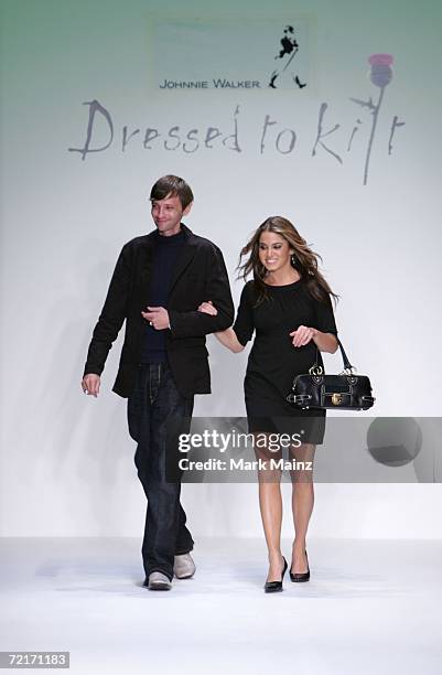 Actor DJ Qualls and actress Nikki Reed walk the runway at the Johnnie Walker Dressed to Kilt 2006 fashion show during the Mercedes Benz Fashion Week...
