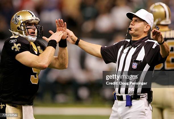 Quarterback Drew Brees of the New Orleans Saints calls a time out to referee Billy Vinovich with :03 seconds on the clock before kicker John Carney...