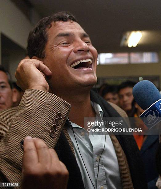 Ecuadorean presidential candidate Rafael Correa gestures as he listens to the first results of the national elections in Quito, 15 October 2006....