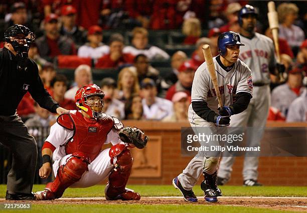 Carlos Beltran of the New York Mets hits a solo home run in the third inning against the St. Louis Cardinals during game four of the NLCS at Busch...