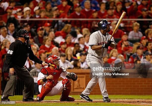 Carlos Delgado of the New York Mets watches a three-run home run in the fifth inning against the St. Louis Cardinals during game four of the NLCS at...