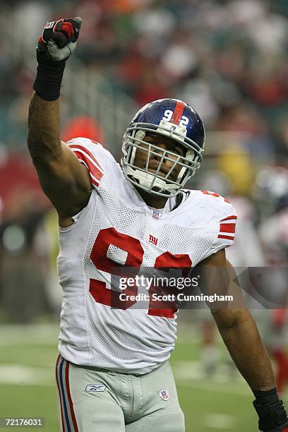 Michael Strahan of the New York Giants celebrates during the game against the Atlanta Falcons at the Georgia Dome on October 15, 2006 in Atlanta,...