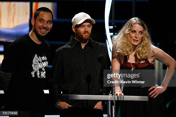 Musicians Mike Shinoda and Dave "Phoenix" Farrell of the band Linkin Park with actress Shauna McDonald present the "Best Butcher" award on stage...