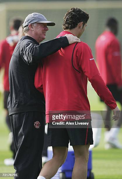 Sir Alex Ferguson the manager of Manchester United talks with Cristiano Ronaldo during the Manchester United training session at the Carrington...