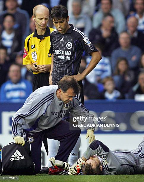 Reading, UNITED KINGDOM: - Chelsea's goalkeeper Petr Cech lies injured after an early tackle during the Premiership football match at Madejski...