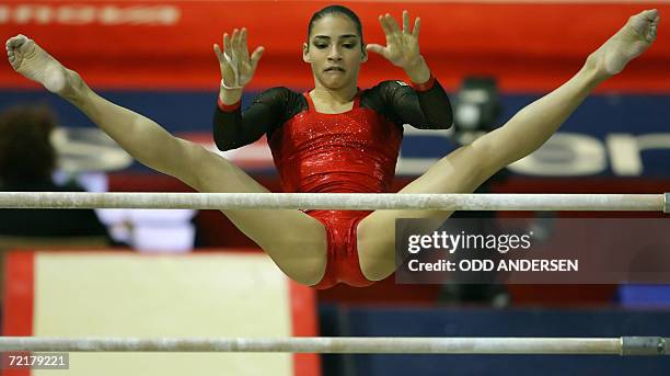 Lais Souza of Brasil performs on the uneven bars in the women's qualifiers at the Arena in Aarhus, 16 October 2006 at the 39th Artistic Gymnastics...
