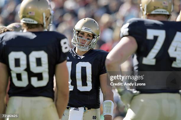 Quarterback Brady Quinn of Notre Dame Fighting Irish leads the huddle with John Carlson and Sam Young during the game against the Stanford Cardinal...
