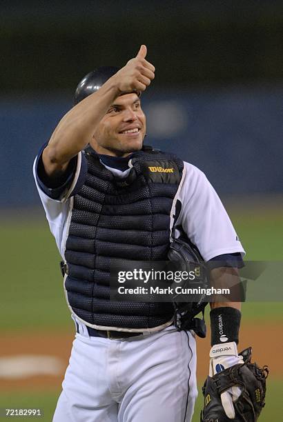 Ivan Rodriguez of the Detroit Tigers catches during the American League Championship Series Game against the Oakland Athletics at Comerica Park in...