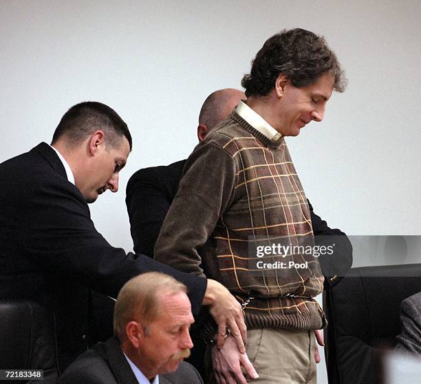 Joseph Edward Duncan III , is seated next to his Public Defender John Adams , during a plea agreement and sentencing hearing in the court room of the...