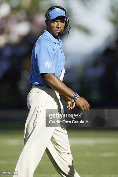 Head coach Karl Dorrell of the UCLA Bruins reacts to play while walking the sideline during the game against the Washington Huskies on September 23,...