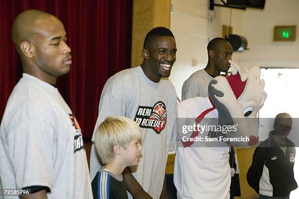Jarrett Jack, Martell Webster, Blazer the Trail Cat, and Travis Outlaw of the Portland Trail Blazers participate in the NBA's Read to Achieve Program...