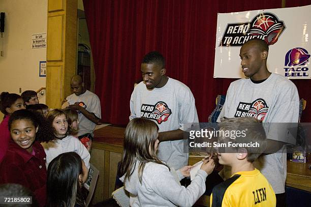 Jarrett Jack, Martell Webster, and Travis Outlaw of the Portland Trail Blazers ineract with kids during the NBA's Read to Achieve Program October 16,...