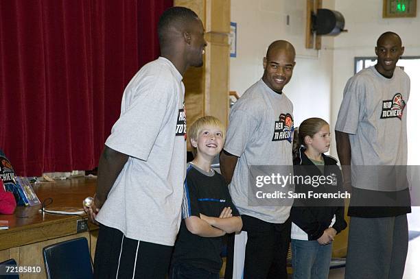 Martell Webster, Jarrett Jack and Travis Outlaw of the Portland Trail Blazers address the assembly during a school visit in conjuction with the NBA's...