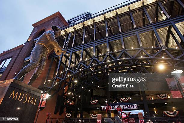 Statue of former St. Louis Cardinal Hall of Fame member, Stan Musial stands in the rain outside of Busch Stadium after game five of the NLCS between...