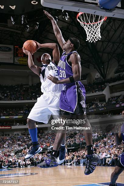 Maurice Ager of the Dallas Mavericks shoots against Justin Williams of the Sacramento Kings during the preseason game on October 12, 2006 at the...