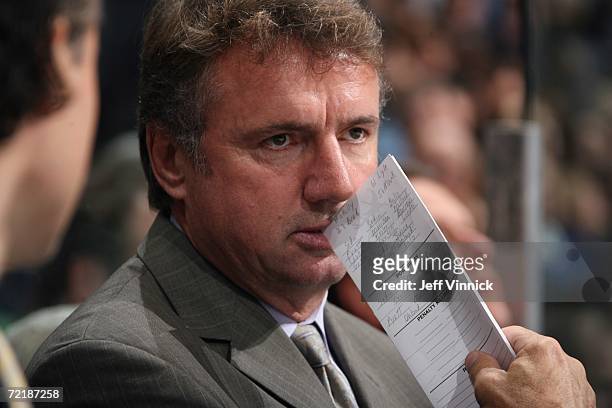Assistant coach Rick Bowness of the Vancouver Canucks looks on against the Calgary Flames during their preseason game at General Motors Place on...