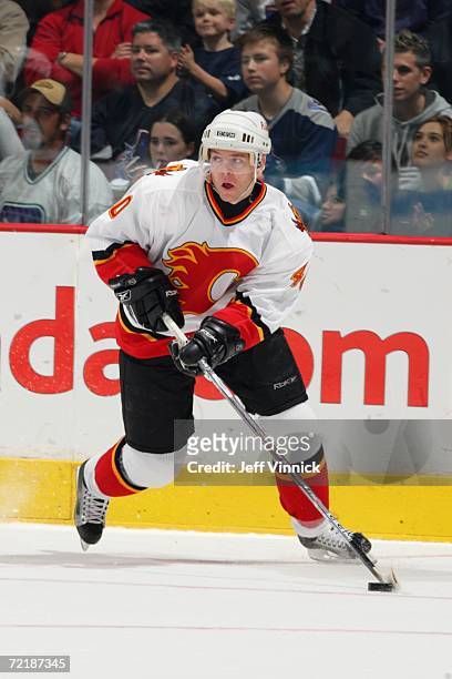 Alex Tanguay of the Calgary Flames handles the puck against the Vancouver Canucks during their preseason game at General Motors Place on September...