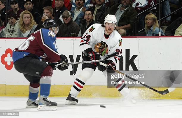 Martin Havlat of the Chicago Blackhawks works against John-Michael Liles of the Colorado Avalanche in the second period on October 16, 2006 at the...