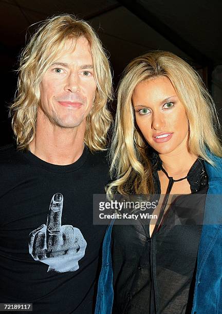 Musician Duff McKagan and wife designer Susan Holmes attend Mercedes Benz Fashion Week at Smashbox Studios on October 16, 2006 in Culver City,...