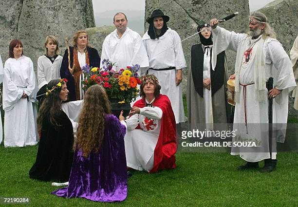 Amesbury, UNITED KINGDOM: Druids perform a pagan Samhain blessing ceremony at the Stonehenge monument, in Wiltshire, in southern England, 17 October...