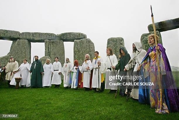 Amesbury, UNITED KINGDOM: Druids perform a pagan Samhain blessing ceremony at the Stonehenge monument, in Wiltshire, in southern England, 17 October...