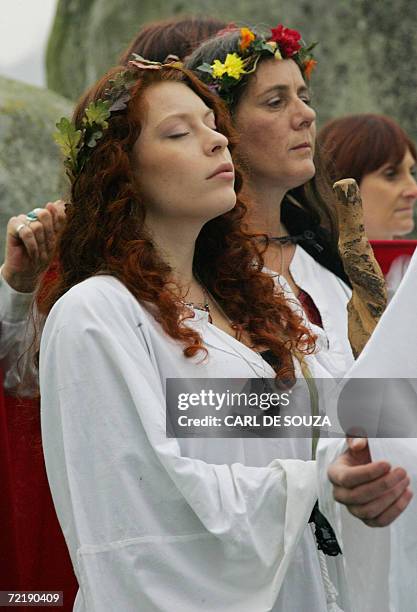 Amesbury, UNITED KINGDOM: Druids perform a pagan Samhain blessing ceremony at the Stonehenge monument, in Wiltshire, in southern England, 17 October...