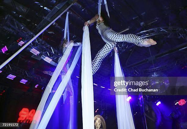 Trapeze artists perform at 944 Magazine's 'Don't Tell My Booker' party at the Vanguard on October 16, 2006 in Los Angeles, California.