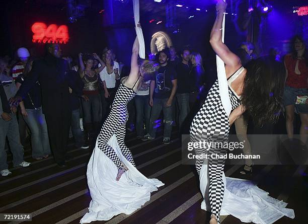 Trapeze artists perform at 944 Magazine's 'Don't Tell My Booker' party at the Vanguard on October 16, 2006 in Los Angeles, California.