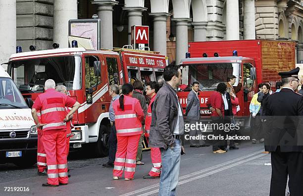 Paramedics work under the Metro sign next to the Vittorio Emanuele Metro Station where two tube trains collided at the height of rush hour on October...