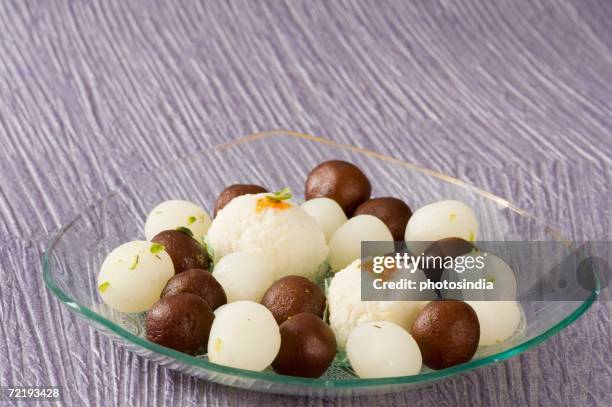 Gulab Rasagulla 166 Rasgulla Stock Photos, High-Res Pictures, and Images - Getty Images