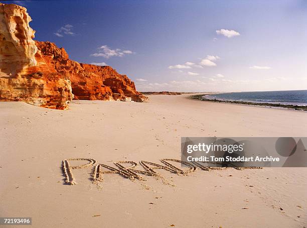 The word paradise written in the sand on the beach at Cape Leveque, Western Australia.