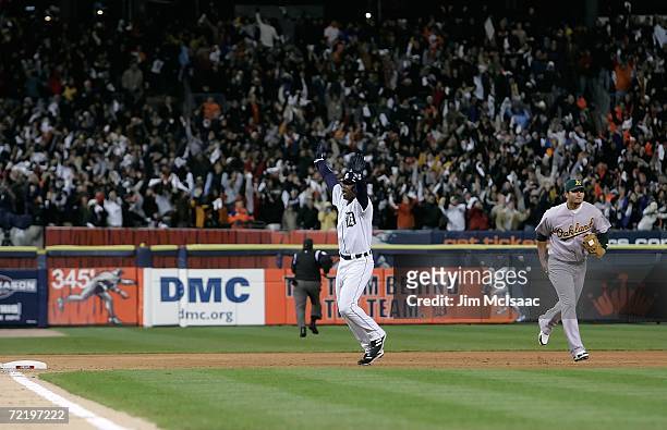 Craig Monroe of the Detroit Tigers celebrates as he heads into third base on a 3-run walk-off home run, hit by Magglio Ordonez, against the Oakland...