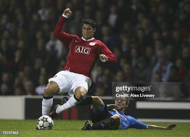 Cristiano Ronaldo of Manchester United evades Michael Silberbauer of FC Copenhagen during the UEFA Champions League Group F match between Manchester...