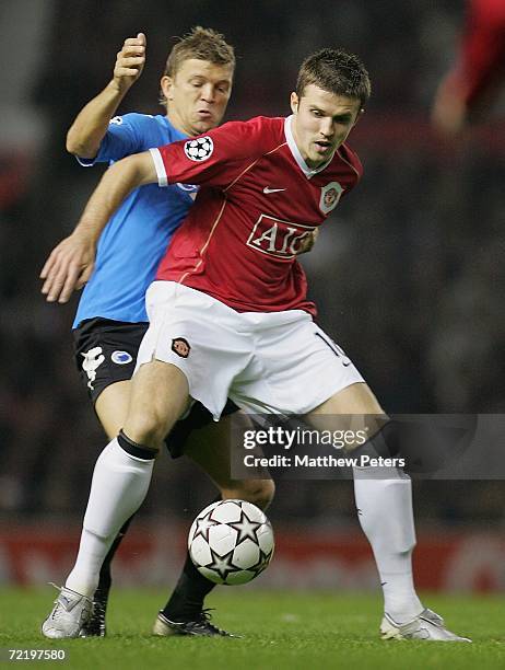 Michael Carrick of Manchester United clashes with Michael Silberbauer of FC Copenhagen during the UEFA Champions League match between Manchester...