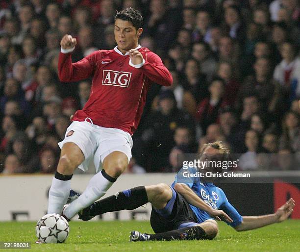 Cristiano Ronaldo of Manchester United clashes with Michael Silberbauer of FC Copenhagen during the UEFA Champions League match between Manchester...